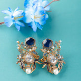 Ornate gold and blue earrings with pearls