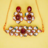 Jewelry set with necklace and earrings on a yellow background