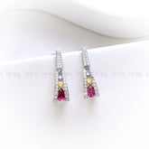Pair of earrings with gemstones on a white background