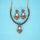 Jewelry set with necklace and earrings on a blue background