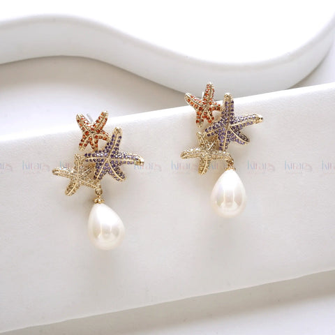 Starfish-shaped earrings with pearl drops
