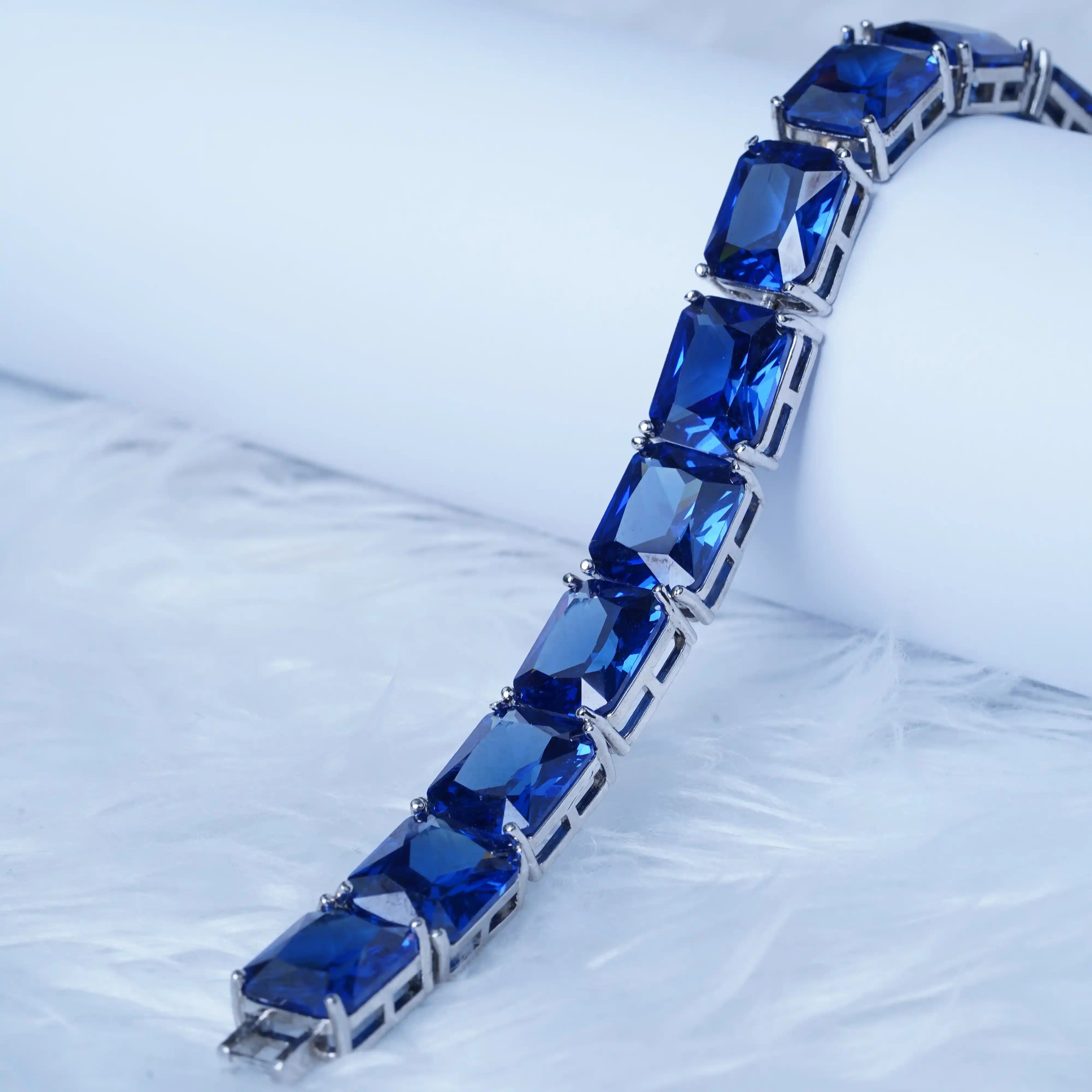 Bracelet with blue gemstones on a light gray background