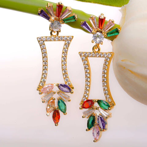 Colorful earrings with gold frame on a white background