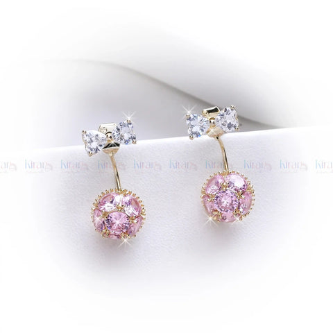 Pair of earrings with pink gemstones and gold accents on a white background