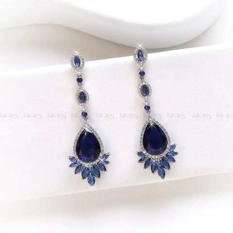 Pair of blue teardrop earrings on a white background