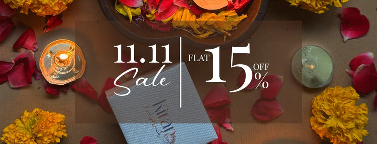 Promotional banner for a 11.11 sale with flowers and candles on a wooden surface.
