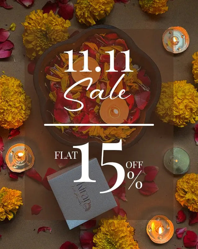 Promotional graphic for a 11.11 sale with flowers and candles on a brown background
