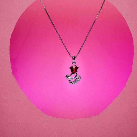 Necklace with a heart-shaped pendant on a pink background