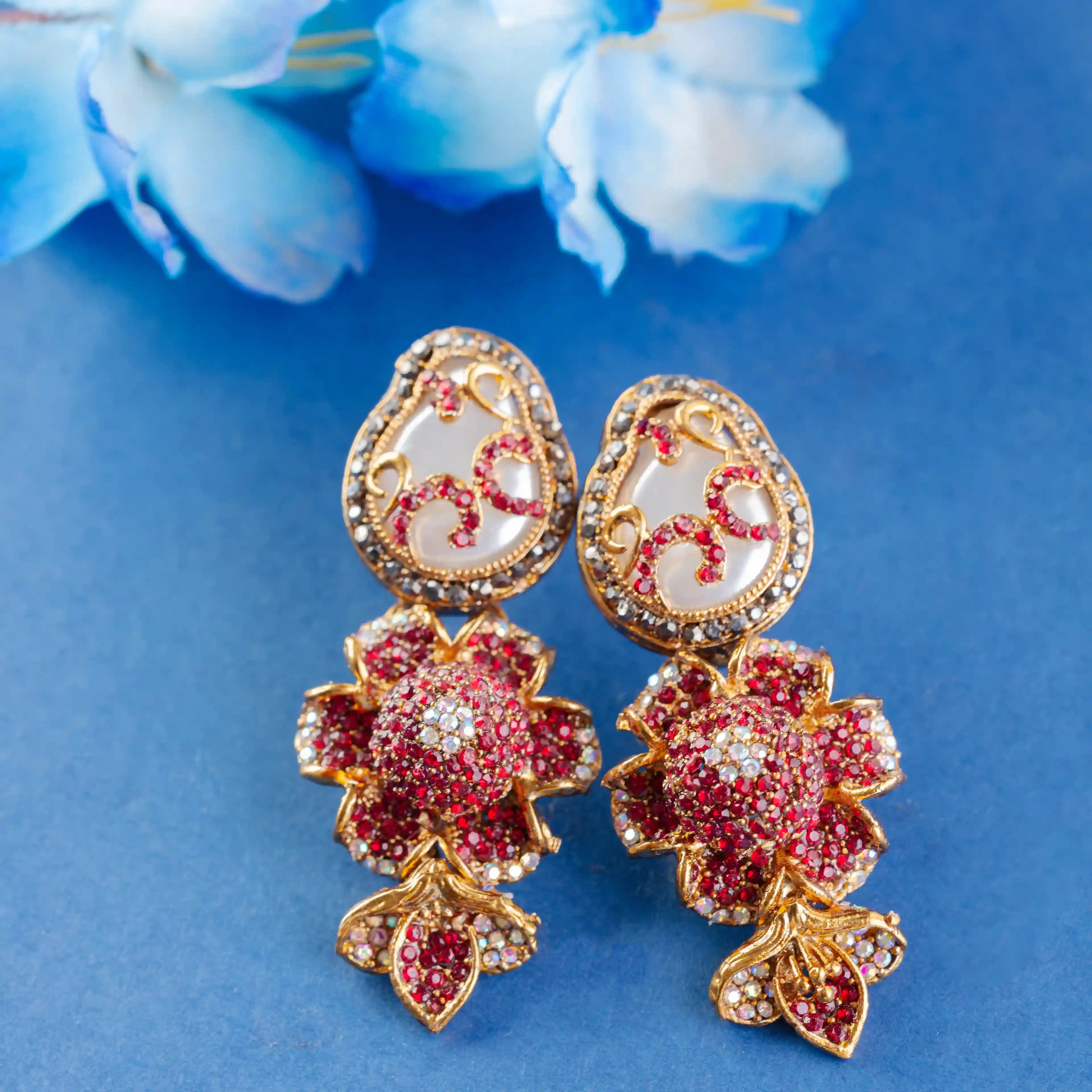 Ornate earrings with red and gold