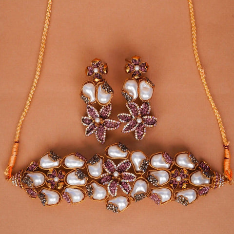 Jewelry set with necklace, earrings, and bracelet on a brown background