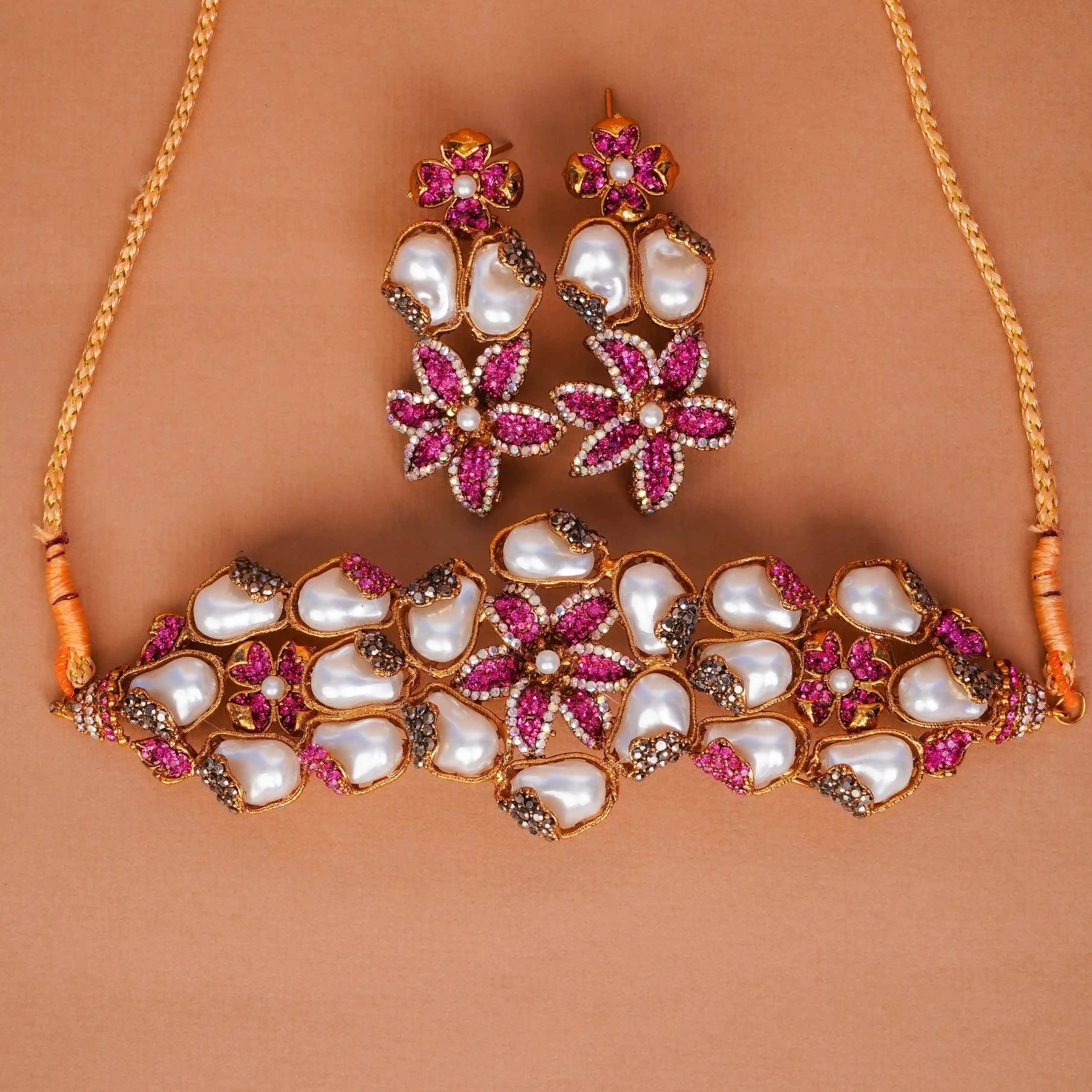 Jewelry set with necklace and earrings on a brown background