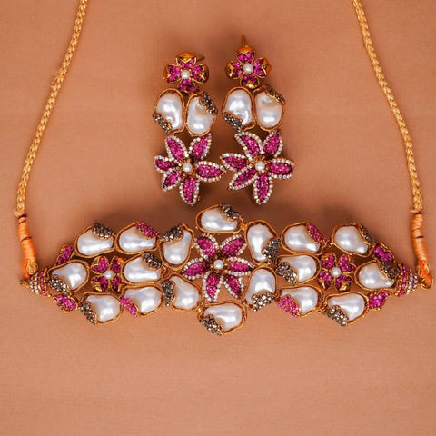 Jewelry set with necklace and earrings on a brown background