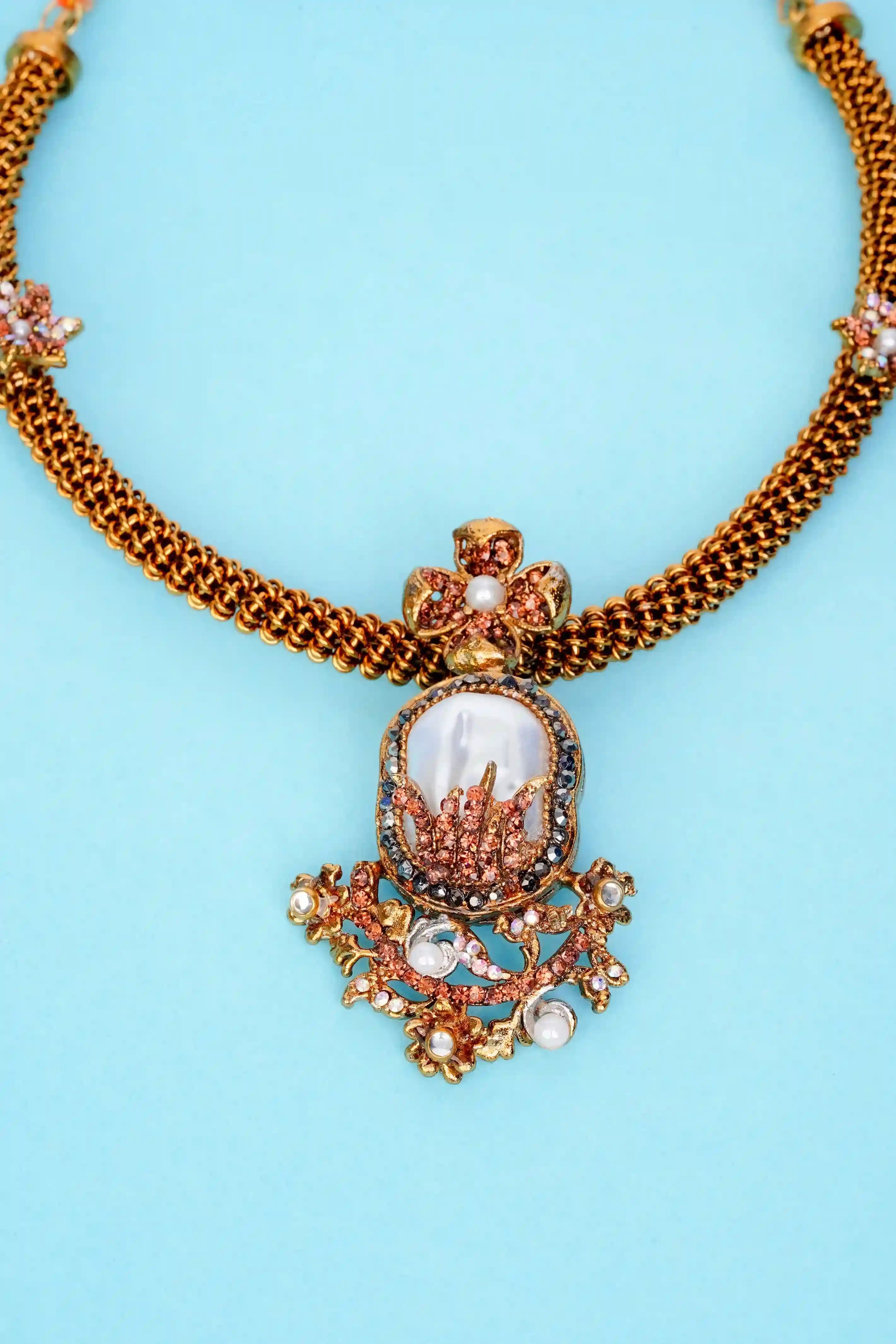 Decorative necklace with a central pendant