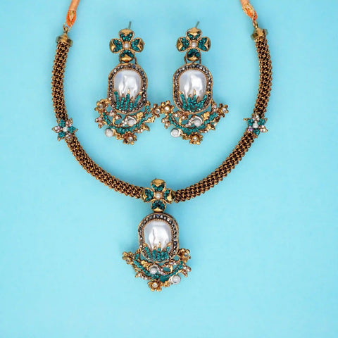 Jewelry set with necklace and earrings on a light blue background